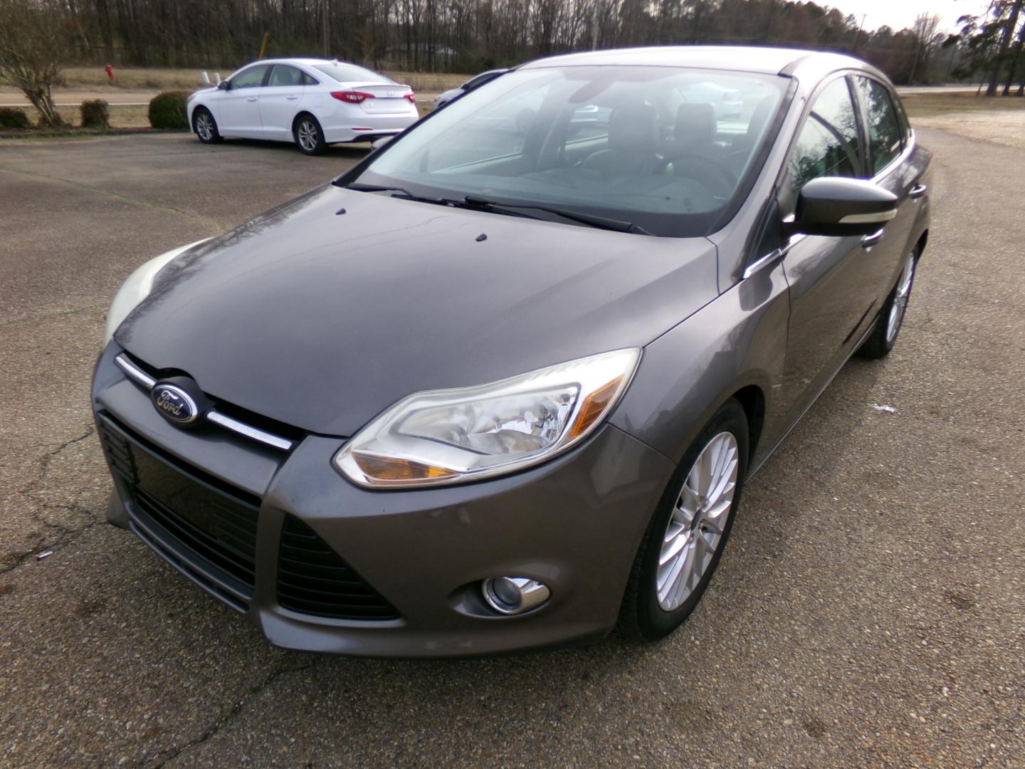 2012 Sterling Gray Metallic /tan Ford Focus SEL (1FAHP3H26CL) with an 2.0L engine, automatic transmission, located at 401 First NE, Bearden, AR, 71720, (870) 687-3414, 33.726528, -92.611519 - Photo#0